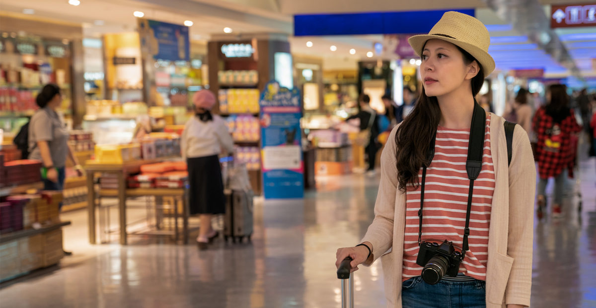 woman walking through an airport