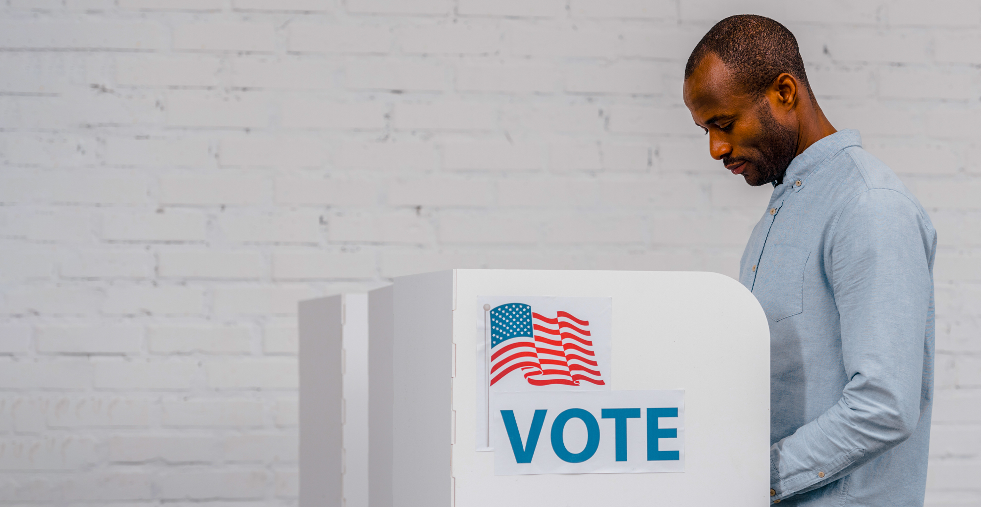 Man voting at a voting booth